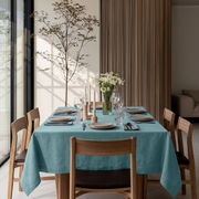 Aquamarine Blue Rectangular Linen Tablecloth in a Modern Dining Room with Wood Slat Wall and Floor-to-Ceiling Windows