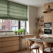 Asparagus Green Linen Roman Blinds in a Modern Kitchen with Light Wood Cabinetry - Cotton Lining