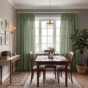 A Styled Dining Room Featuring Asparagus Green Curtain Panels Hanging On A White Rod Over A Multi-Pane Window