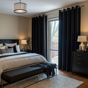 Black Velvet Eyelet Blackout Curtains in a Bedroom with Tan Walls