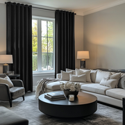 Black Velvet Eyelet Blackout Curtains in a Living Room with Grey Walls