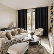 Black Velvet Eyelet Blackout Curtains in a Living Room with Warm White Walls