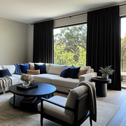 Black Velvet Rod Pocket Blackout Curtains in a Living Room with Light Grey Walls