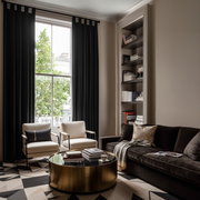 Black Velvet Tab Top Blackout Curtains in a Living Room with Beige Walls