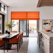 Burnt Orange Linen Roman Blinds in a Contemporary Open-Plan Kitchen with Orange Dining Chairs - Blackout Lining