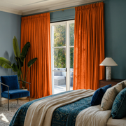 Burnt Orange Linen Pencil Pleat Curtains in a Contemporary Bedroom with Blue Accent Wall - Cotton Lining