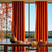 Burnt Orange Linen S-Fold Curtains in a Minimalist Dining Room with Off-White Walls and a Long Wooden Table Paired with Mid-Century Chairs - Blackout Lining