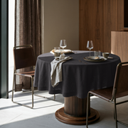 Charcoal Grey Linen Round Tablecloth in a Warm Contemporary Dining Nook with Walnut Cabinetry