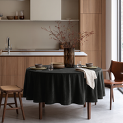 Dark Grey Round Velvet Tablecloth in a Modern Kitchen Dining Area with Warm Wood Cabinetry