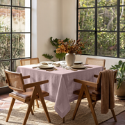 Dusty Pink Square Linen Tablecloth in a Mid-Century Modern Dining Room with Wooden Cane Chairs