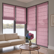 Dusty Rose Roman Blinds in a Contemporary Living Room with Soft Beige Walls and a Round Wooden Coffee Table