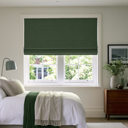 Forest Green Linen Cordless Roman Blinds in a Modern Bedroom with Off-White Walls and a Wooden Dresser