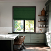 Forest Green Linen Roman Blinds in an Elegant Contemporary Kitchen with a Marble Island - Blackout Lining