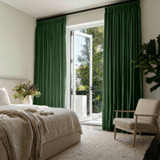 Forest Green Linen Pencil Pleat Curtains in a Bright Bedroom with White Walls and Soft Neutral Textiles - Blackout Lining