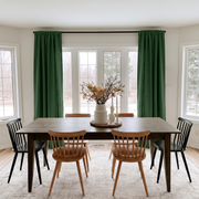 Forest Green Linen Rod Pocket Curtains in a Modern Farmhouse Dining Room with Mixed Wooden Chairs and Winter Views