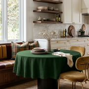 Forest Green Linen Round Tablecloth in a Cozy Breakfast Nook with Warm White Cabinetry, Plaid Textile and Mustard Velvet Chairs