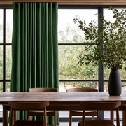 Forest Green Linen S-Fold Curtains in a Modern Organic Dining Room with Large Black-Framed Windows and Natural Wood Furniture