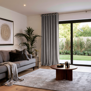 Grey Velvet Eyelets Extra Long Curtains in a Modern Living Room with Grey Sofa, a Round Wooden Coffee Table and a Gray Area Rug