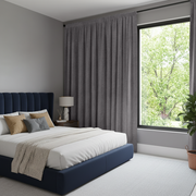 Grey Velvet Rod Pocket Blackout Curtains in a Bedroom with Grey Walls