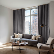 Grey Velvet S-Fold Blackout Curtains in a Living Room with White Walls