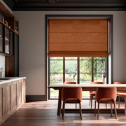 Terracotta Heavy Weight Linen Roman Blinds in a Modern Dining Kitchen with Warm Wood Cabinets