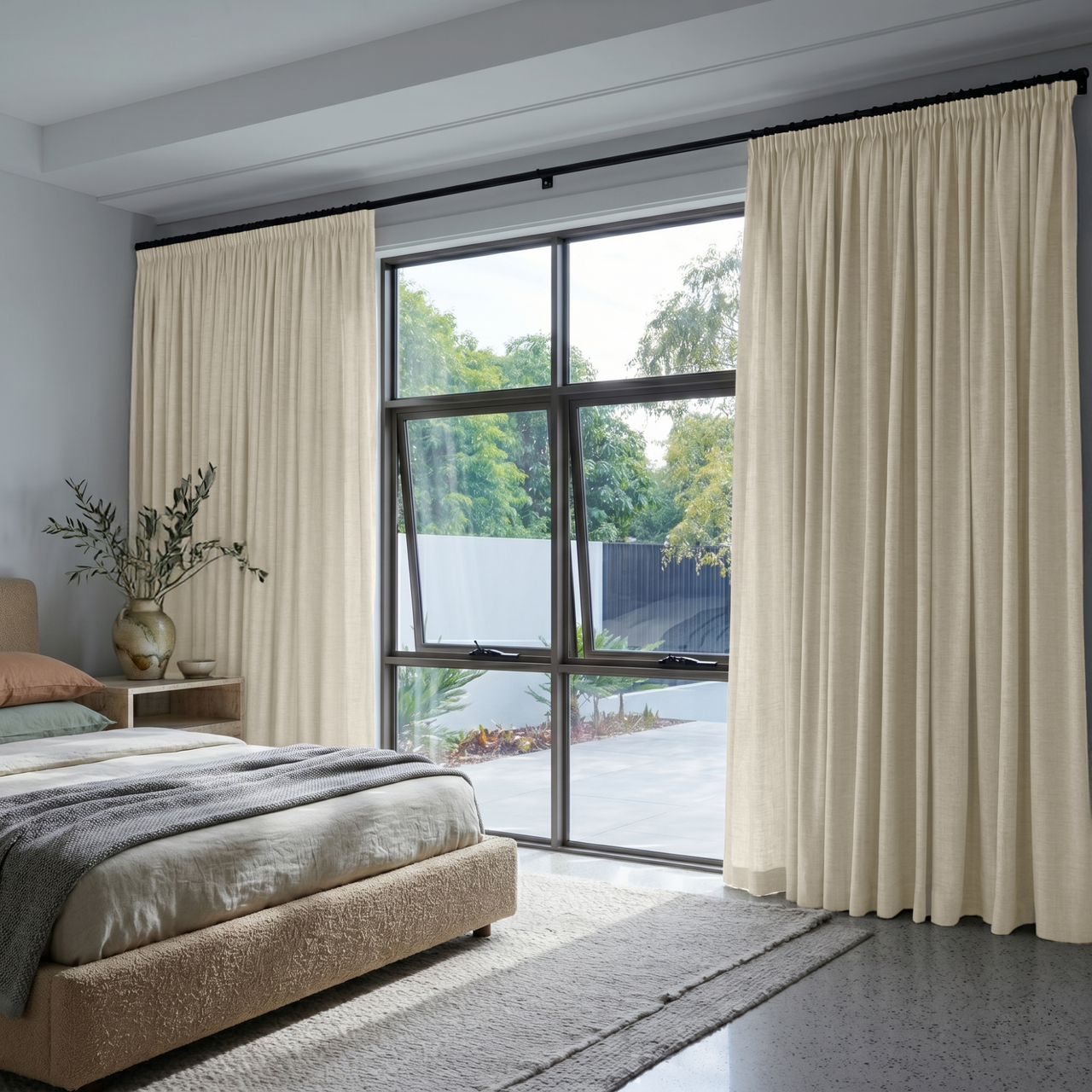 Ecru Heavy Weight Linen Pencil Pleat Bedroom Curtains in a Bright Modern Bedroom with Light Grey Walls