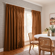 Heavy Weight Terracotta Linen Pinch Pleat Dining Room Curtain in a Rustic Dining Room with Light Gray Painted Brick Walls and Cane Back Dining Chairs Resting On Hardwood Floors - Cotton Lining