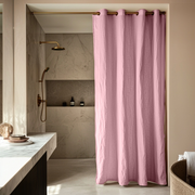 Dusty Rose linen  shower curtain in a modern bathroom with marble walls and a concrete countertop.