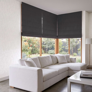 Charcoal Cordless Linen Roman Blinds in a Modern Living Room with Off-White Walls and a White Sectional