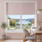 Dusty Pink Roman Blinds in a Modern Dining Room with Warm Pink Walls and a Light Wood Dining Table