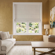 Heavy Ecru Roman Blinds in a Modern Living Room with Textured Gold Walls and a Cream Sofa