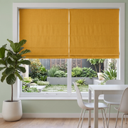 Yellow Roman Blinds in a Modern Living Room with White Walls and a White Sectional Sofa