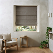 Heavy Natural Roman Blinds in a Minimalist Living Room with Textured Plaster Walls and a Wooden Accent Bench