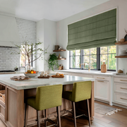 Asparagus Green Linen Roman Blinds in a Bright Contemporary Kitchen with White Cabinetry - Blackout Lining