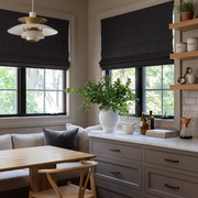 Charcoal Grey Linen Roman Blinds in a Cozy Breakfast Nook with Taupe Cabinetry - Blackout Lining