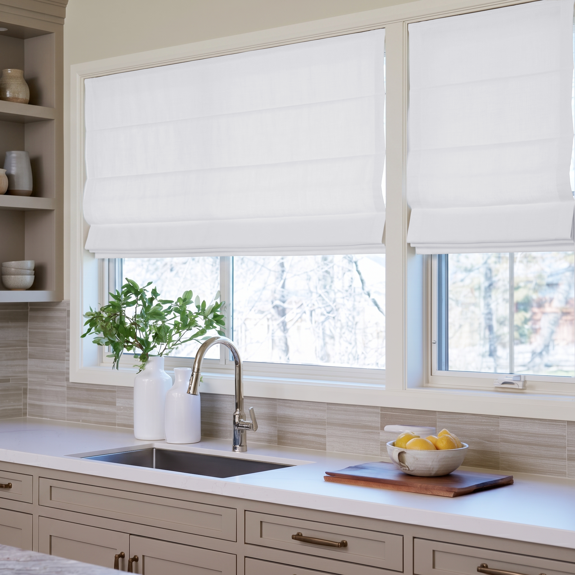 White Linen Kitchen Roman Blinds in a Bright Kitchen with Taupe Cabinets and Beige Tile Backsplash - Blackout Lining