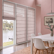 Dusty Pink Roman Blinds in a Contemporary Dining Room with Soft Pink Walls and a White Dining Table