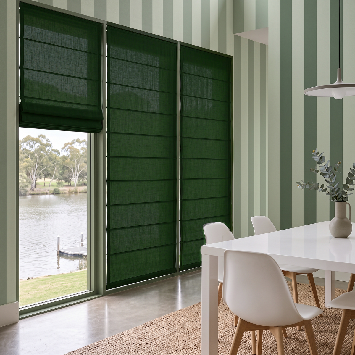 Forest Green Linen Cordless Roman Blinds in a Contemporary Dining Room with Green Striped Wallpaper and a White Dining Table