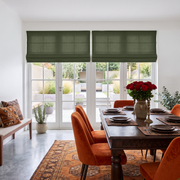 Sage Green Cordless Linen Roman Blinds in a Dining Room with White Walls and Wooden Dining Table