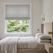 Stone Gray Linen Cordless Roman Blinds in a Modern Bedroom with White Walls and an Upholstered Bed