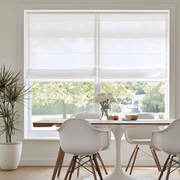 White Linen Cordless Roman Blinds in a Minimalist Dining Room with Neutral Walls and a White Tulip Dining Table