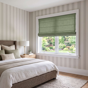 Asparagus Roman Blinds in a Modern Bedroom with Striped Wallpaper and White Bedding