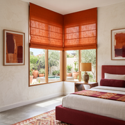 Burnt Orange Linen Cordless Roman Blinds in a Modern Bedroom