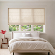 Cream Roman Blinds in a Modern Bedroom with Off-White Walls and a White Bed