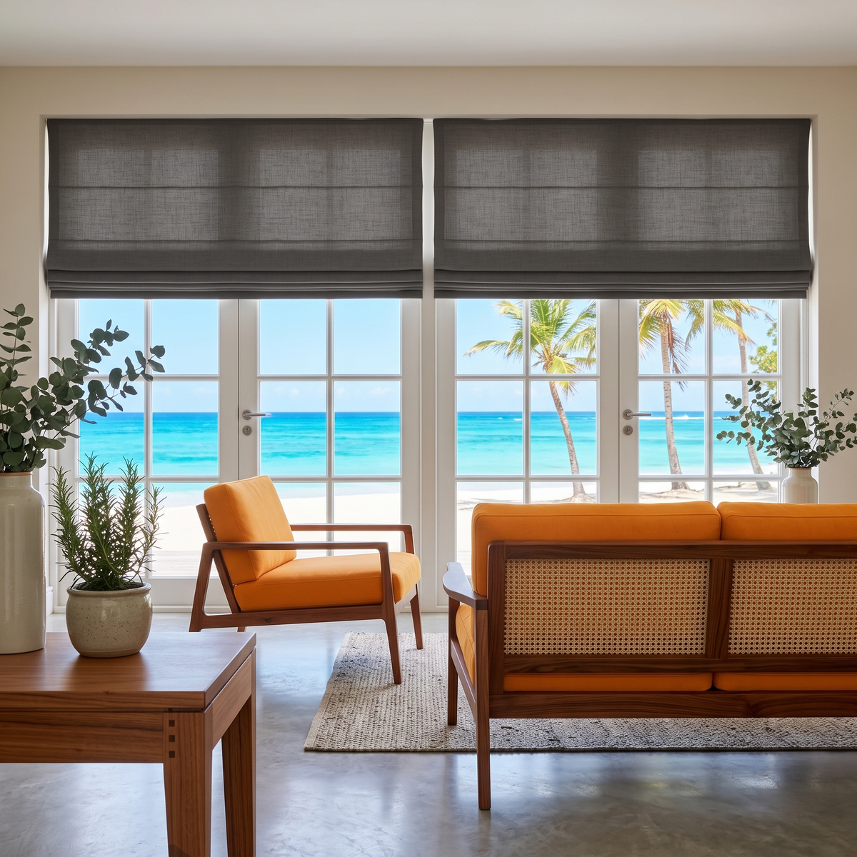 Dim Grey Roman Blinds in a Sunlit Living Room with Off-White Walls and Orange Accent Chairs