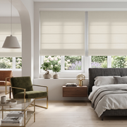 Heavy Ecru Roman Blinds in a Contemporary Bedroom with Off-White Walls and an Olive Green Armchair