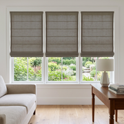 Heavy Natural Roman Blinds in a Contemporary Living Room with White Walls and a Wooden Console Table