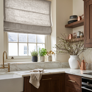 Natural Linen Roman Blinds in a Cozy Kitchen with Walnut Cabinetry