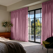 Dusty Rose Linen Pencil Pleat Curtains in a Bright Modern Bedroom with Pale Neutral Walls