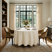 Cream Linen Round Tablecloth in an Elegant Dining Room with Cream Walls and Warm Taupe Velvet Chairs